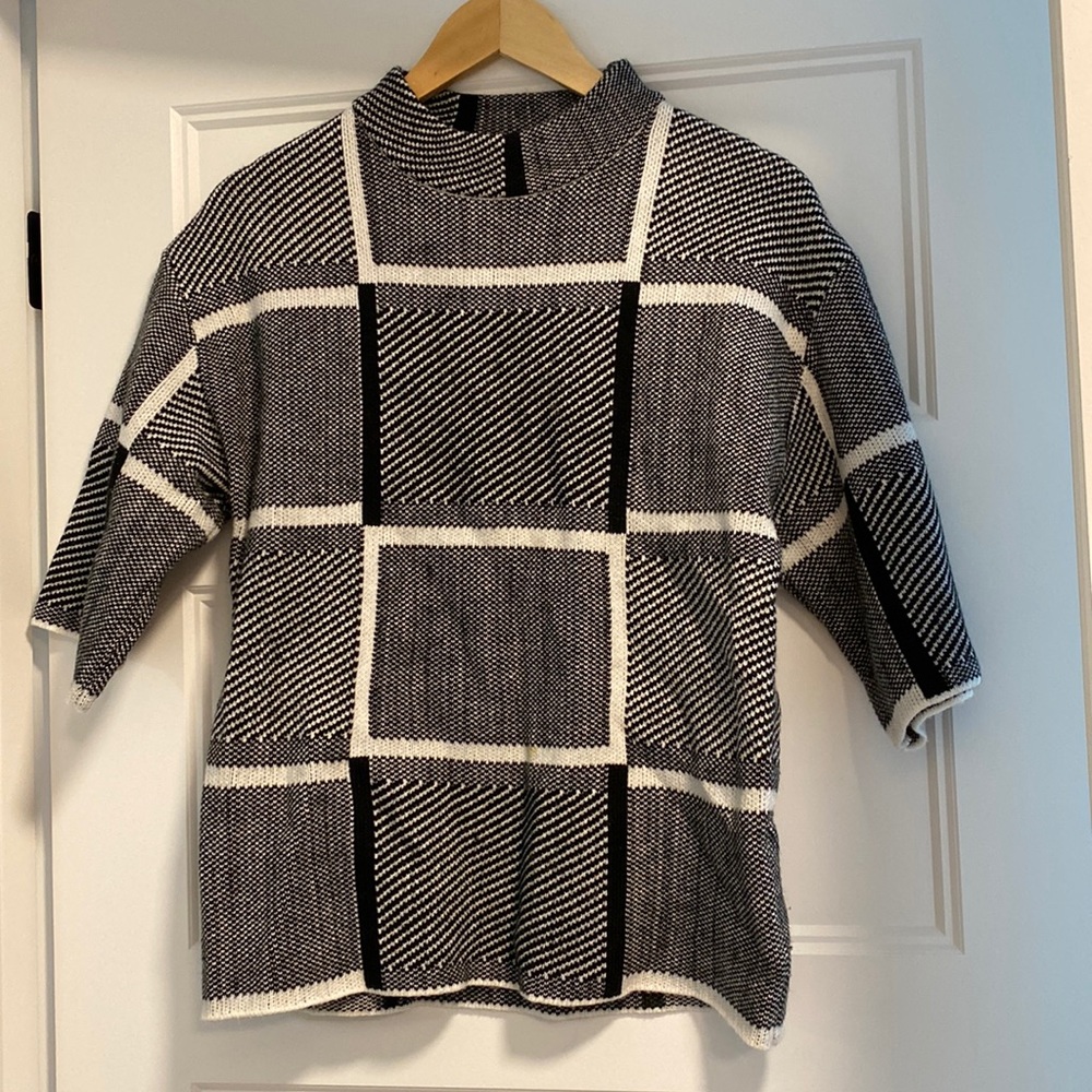 Black and white knit mock-neck sweater